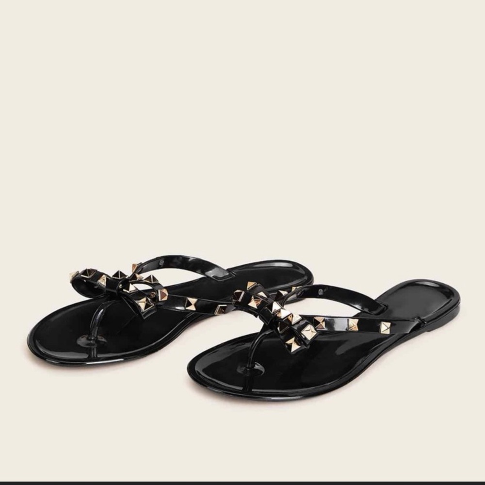 Black gold studded flip flop sandals